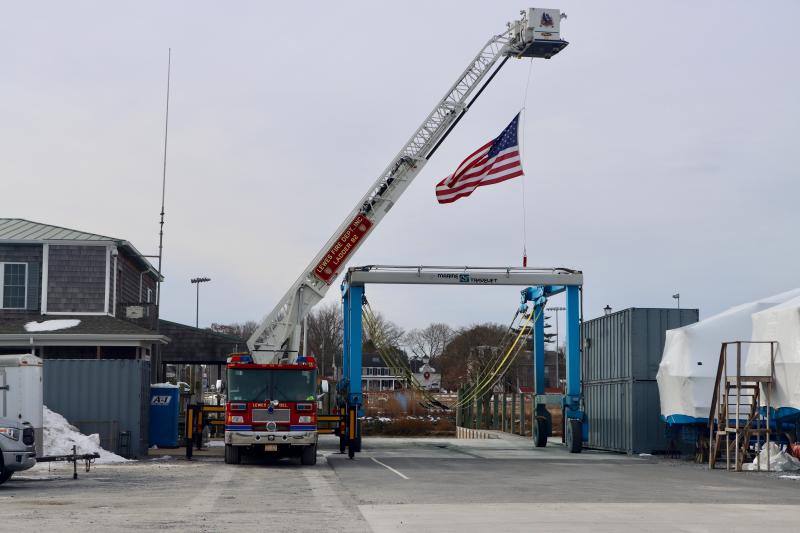 A Lewes fire truck flew a large American flag over Angler’s Marina on Jan. 21, the day of Walsh’s funeral. Walsh was an honorary lifetime member of the department. BILL SHULL PHOTO